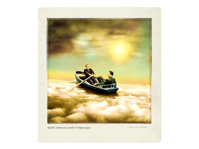 An image of two men in a boat moving downstream