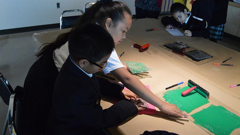 students work on art project