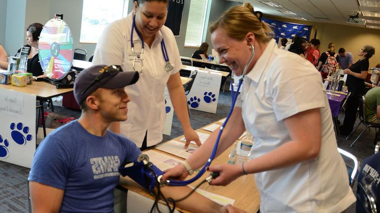 a person getting blood pressure taken