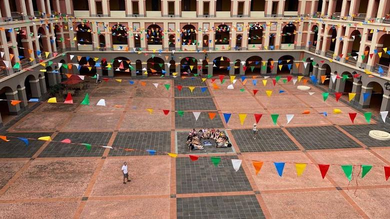 students laying down in square in Puerto Rico infantry barracks