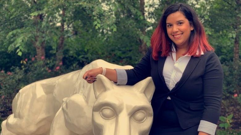 head shot of student: Fatima Alba with Nittany Lion