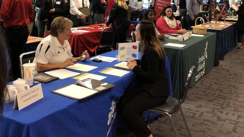 Student interacting at career fair