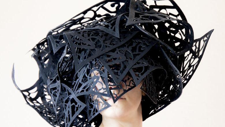 artwork in shape of a hat made of laser cut fiber 