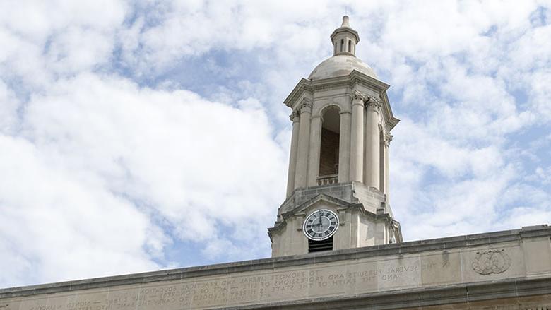 Old Main Bell Tower against Blue and White Sky